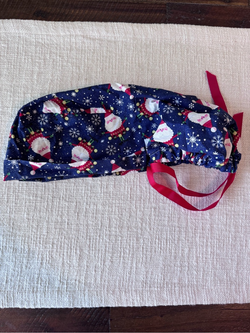 Women’s Navy Santa Print Scrub Cap with Red Ties